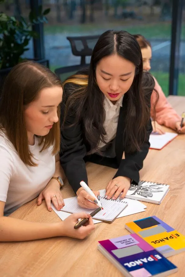 Students learning French together with guided support